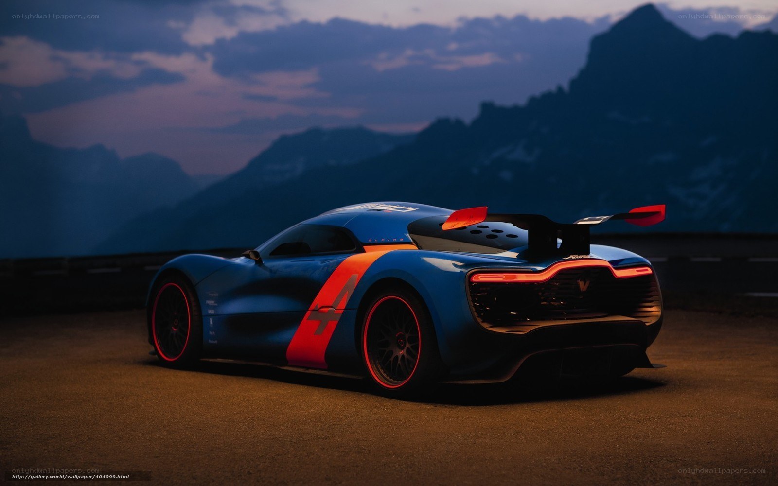 blue race car on mountain road