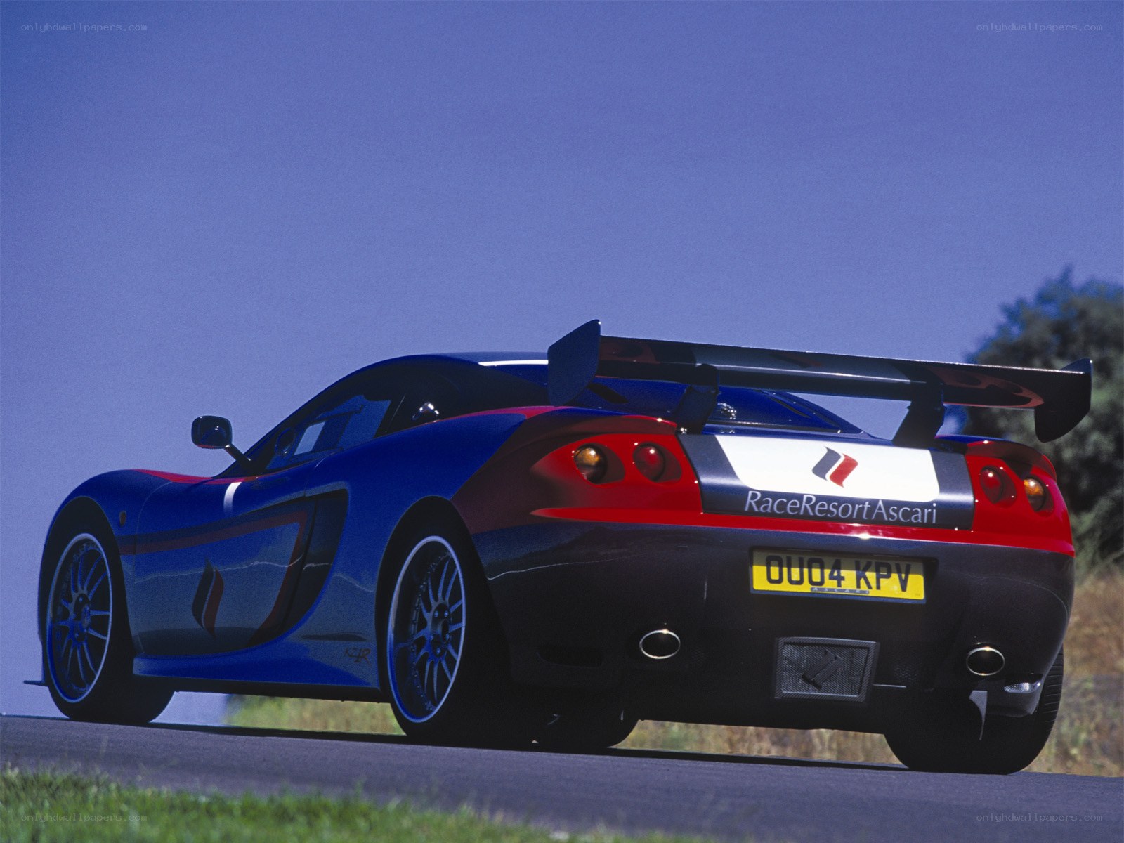 blue race car on road