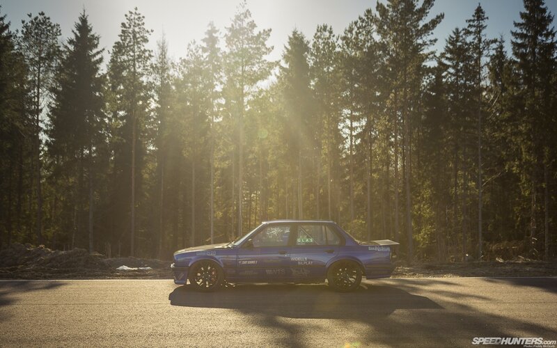 Blue Race Car on Road — Dramatic, Sunset, Photograph