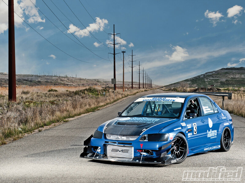 Blue Race Car on Road — Dramatic