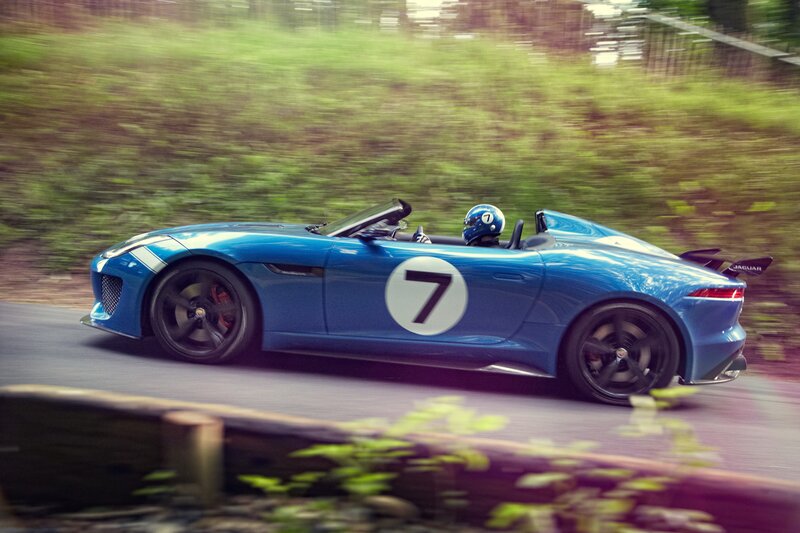 Blue Race Car on Road — Dynamic, Afternoon, Photograph, Driver