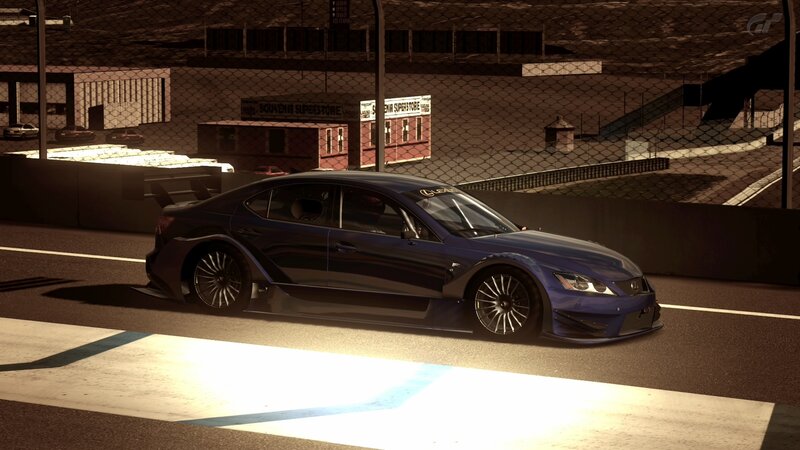 blue race car on track