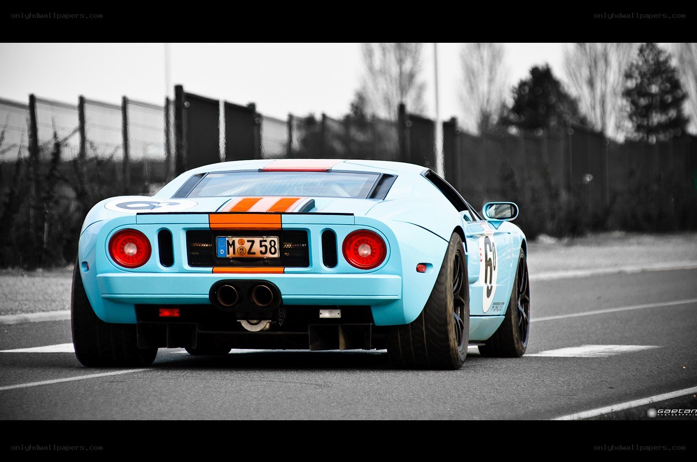 blue race car on track