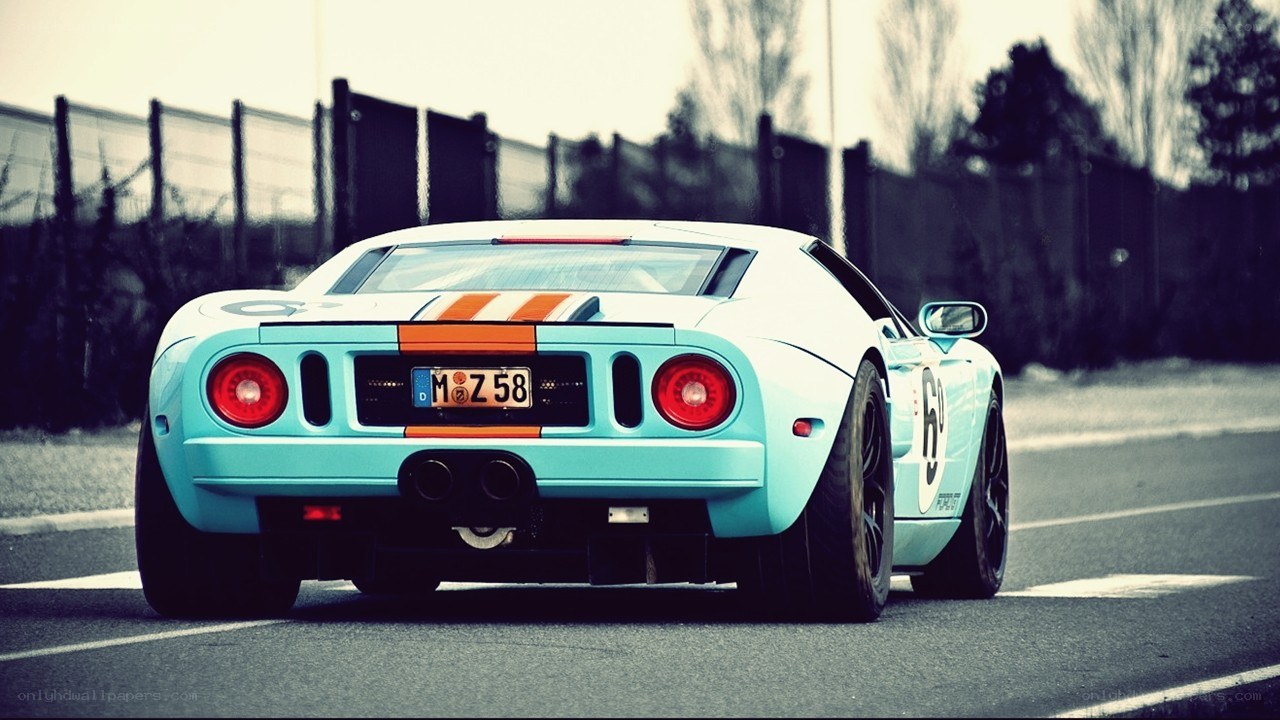 blue race car on track