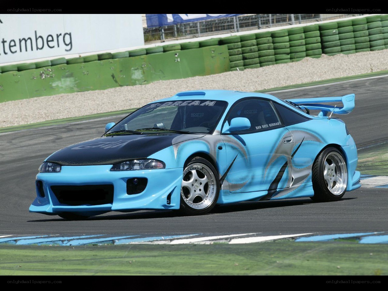 blue race car on track