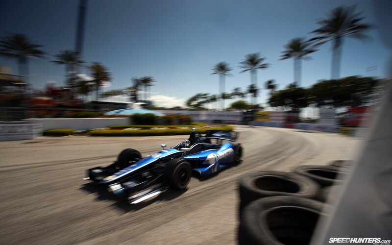 blue race car on track