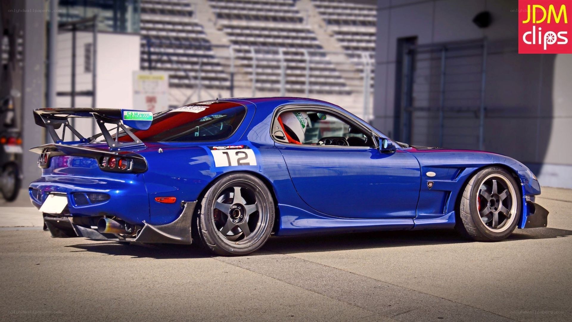 blue race car on track