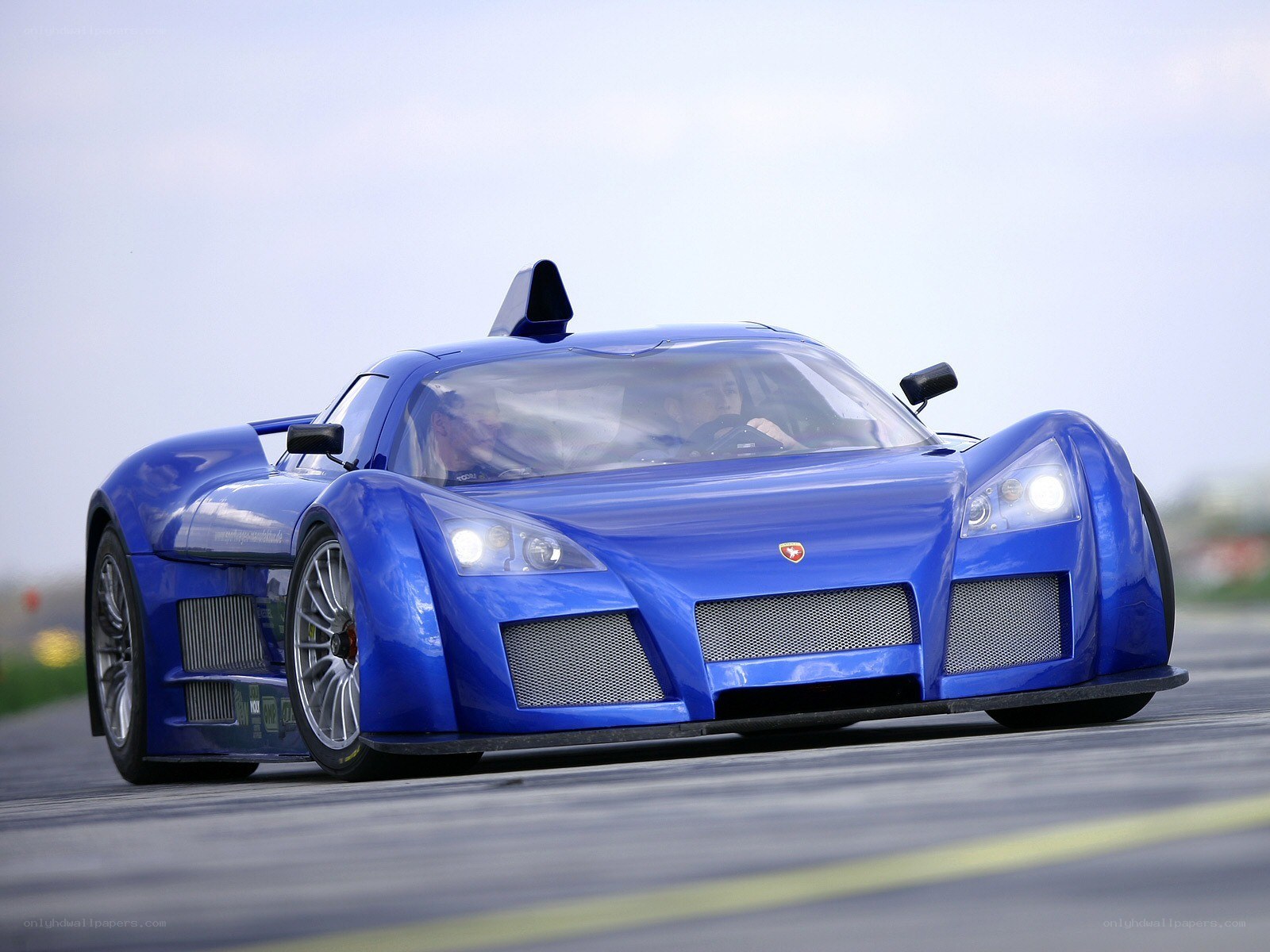 blue race car on track