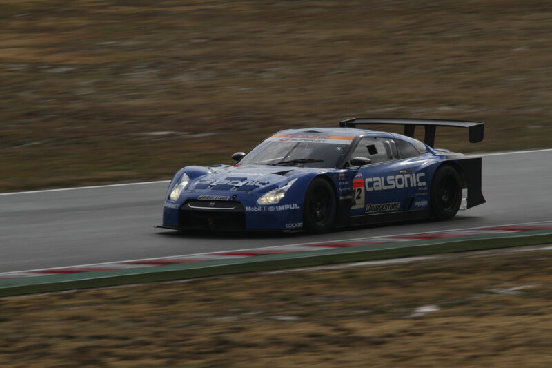 blue race car on track
