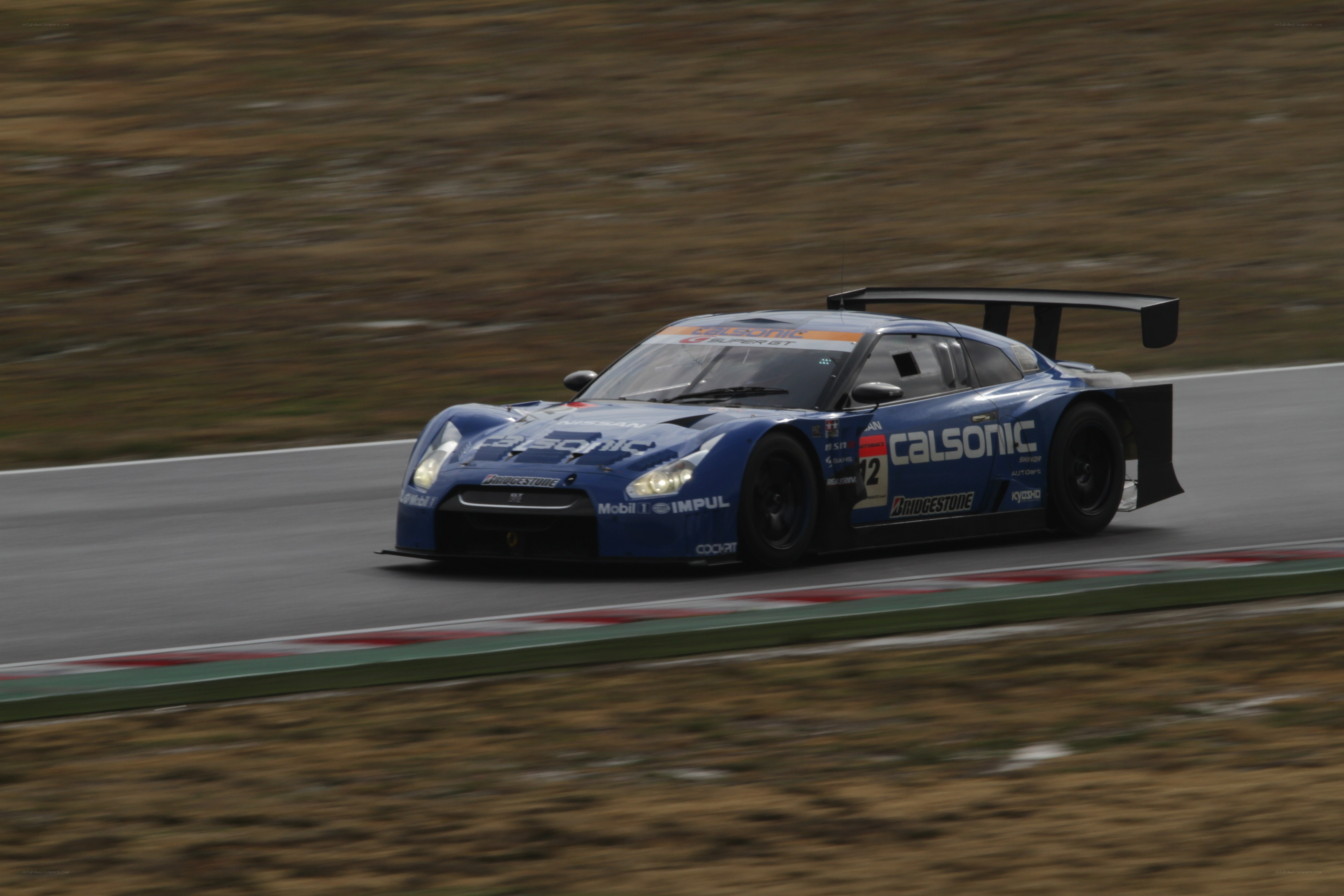 blue race car on track