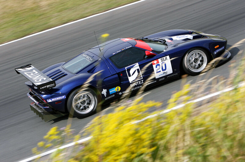 blue race car on track