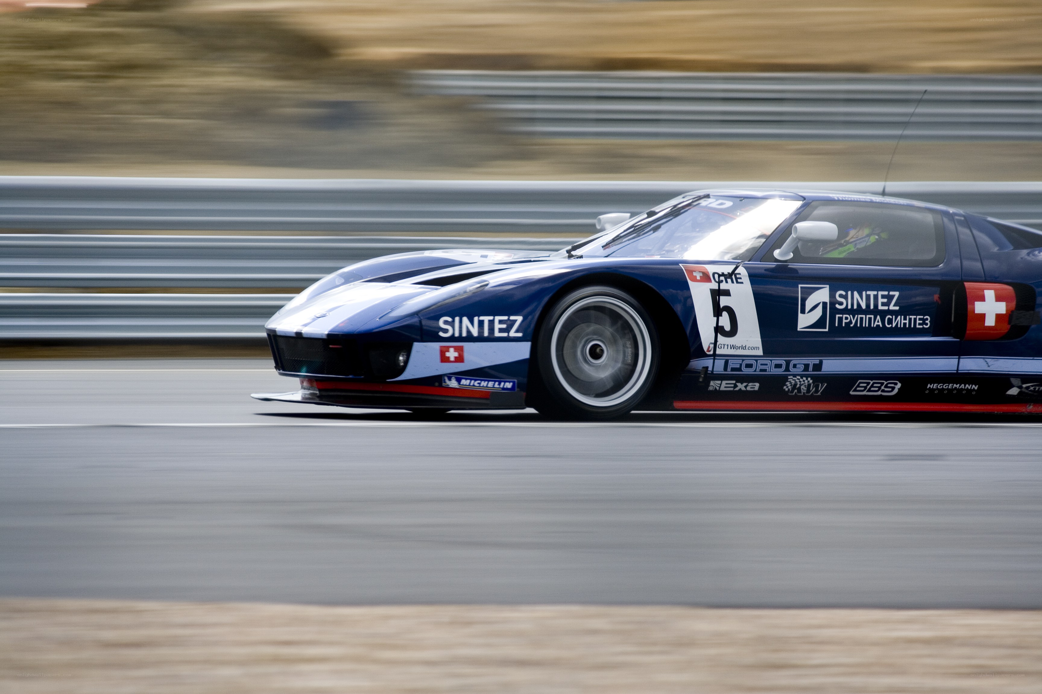 blue race car on track