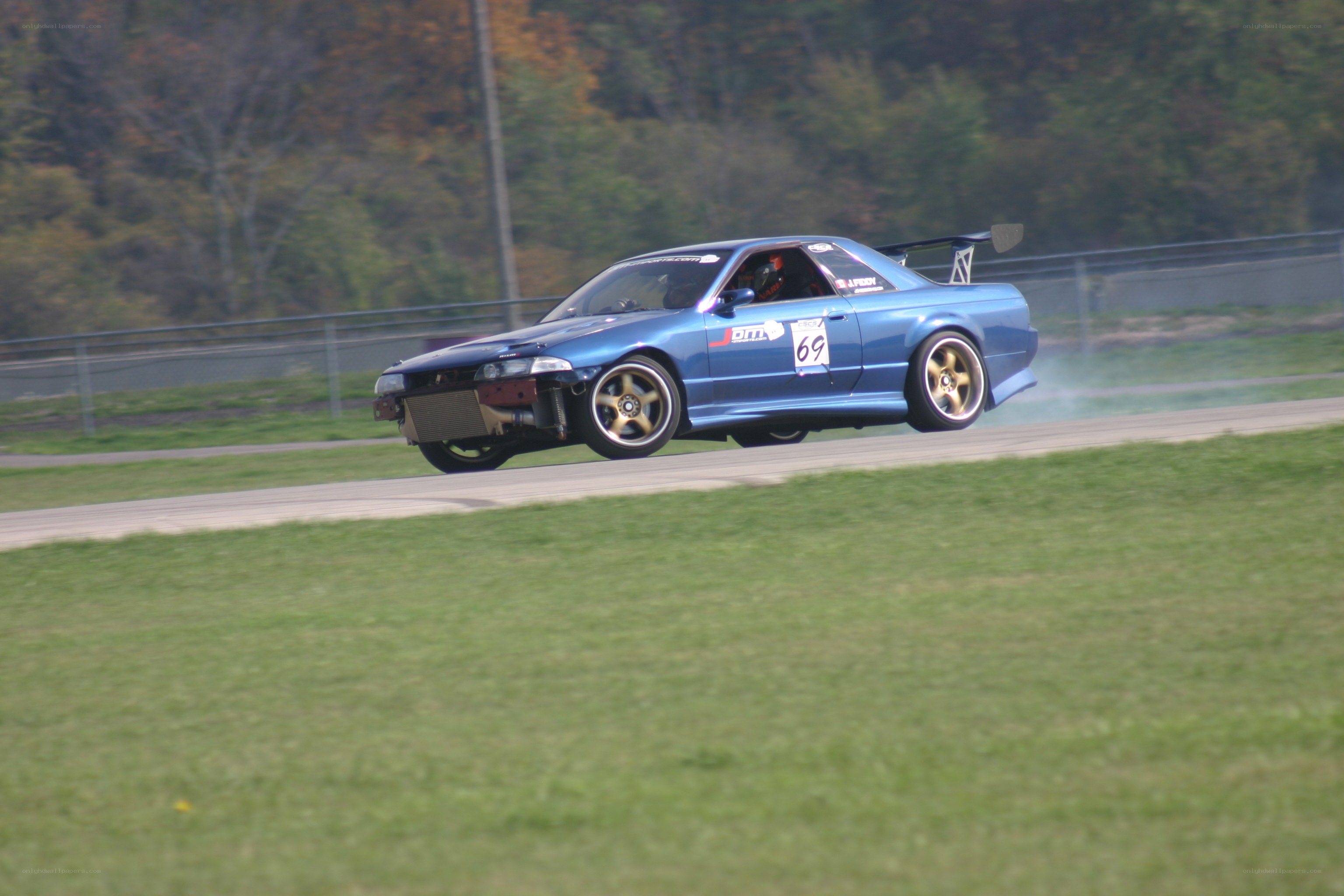 blue race car on track