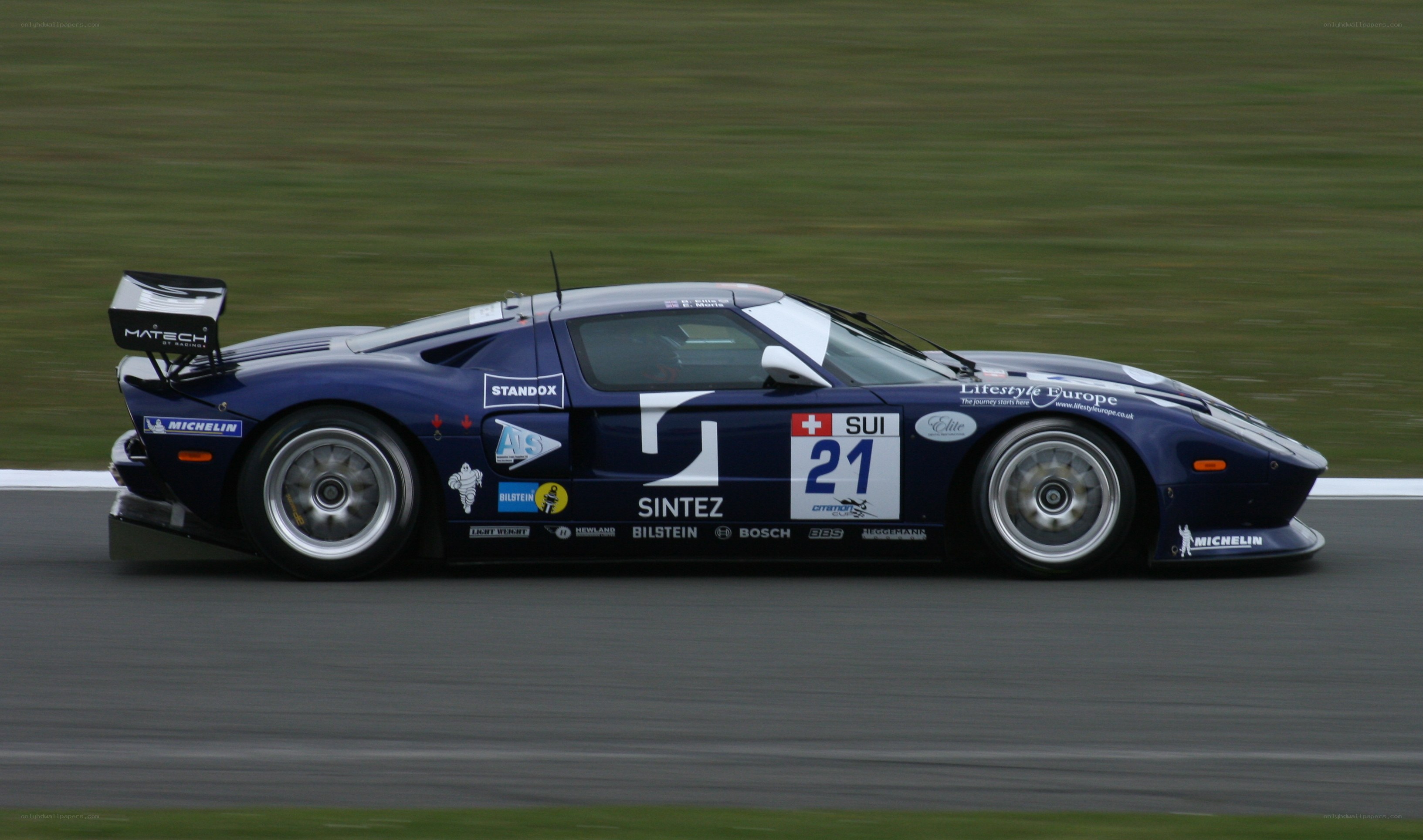 blue race car on track
