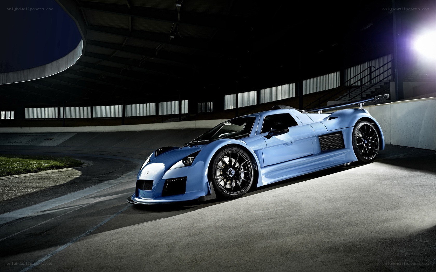 blue race car on track