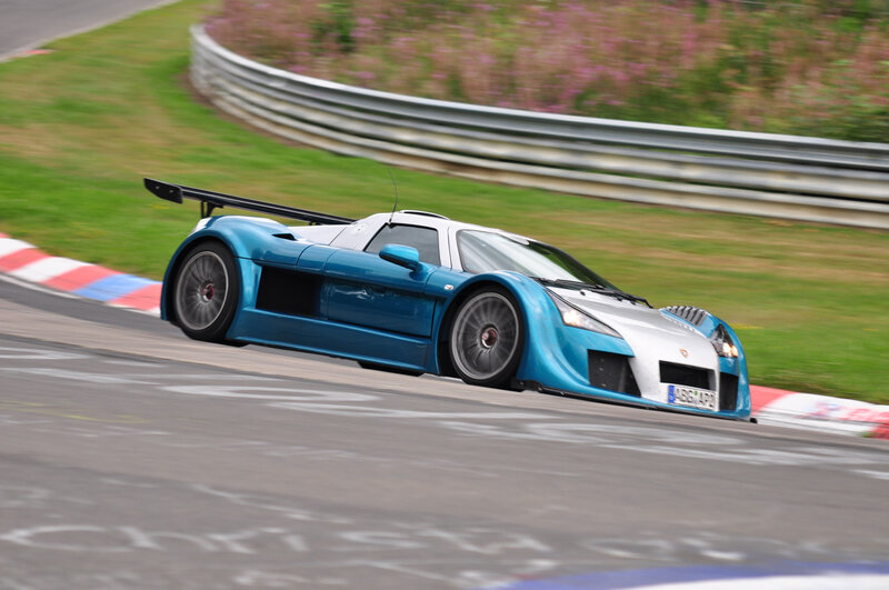 blue race car on track