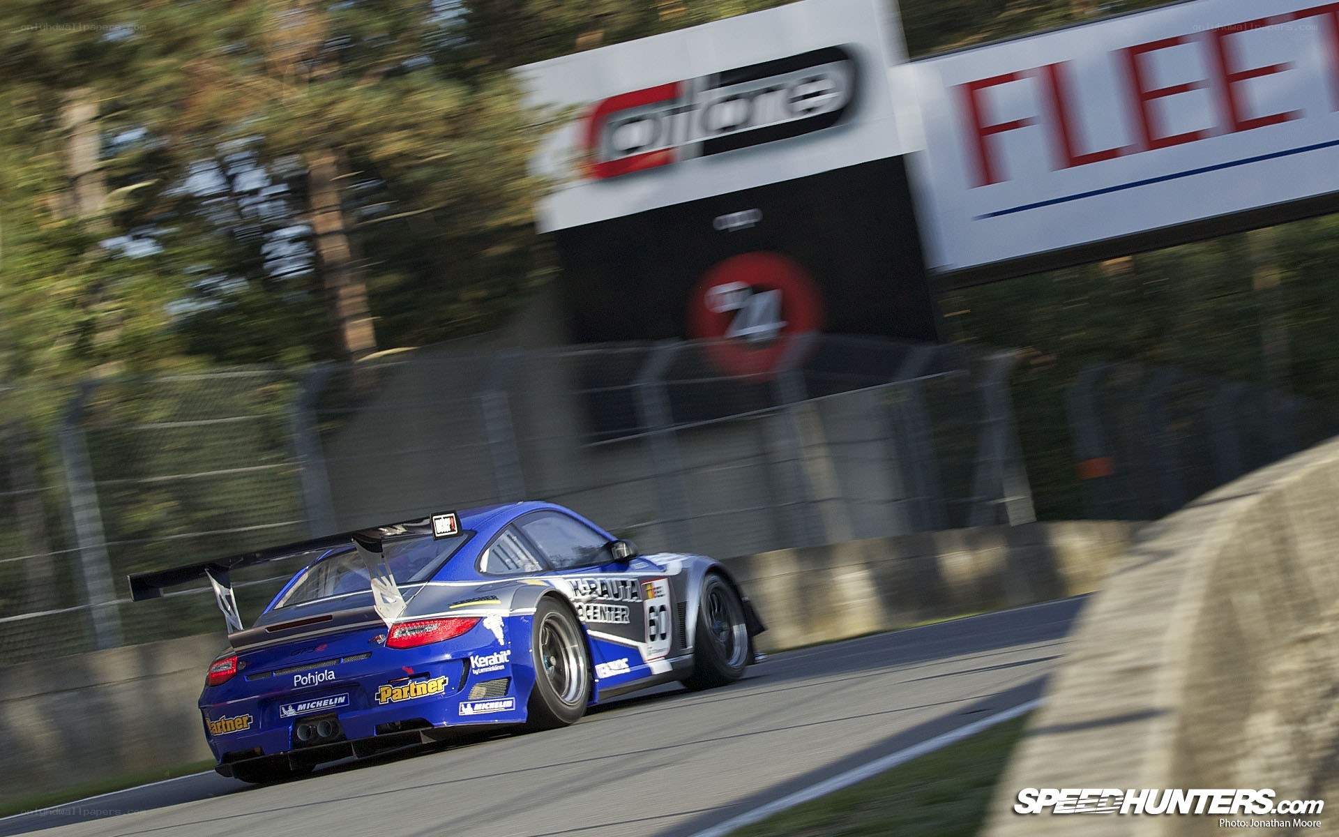 blue race car on track