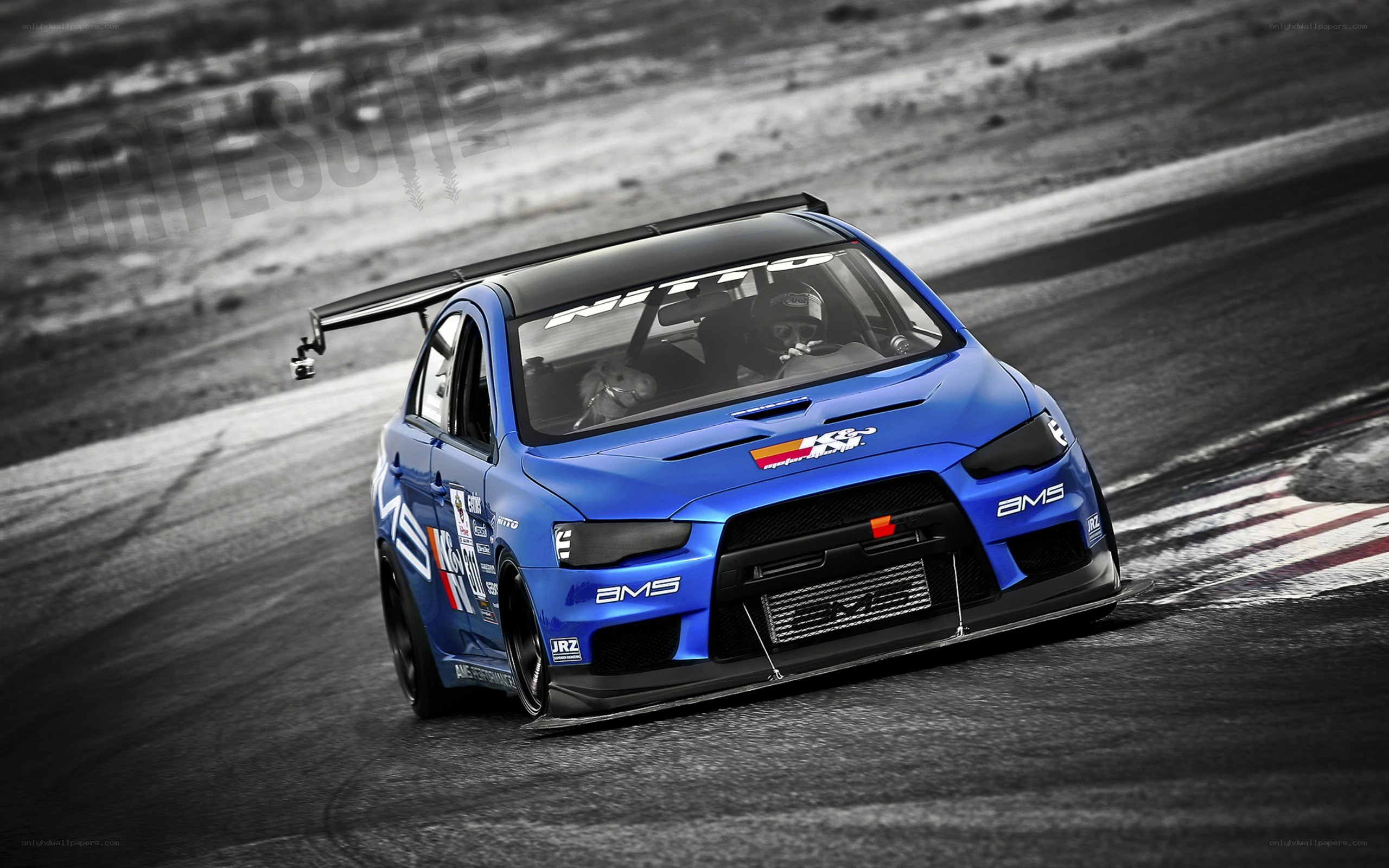 blue race car on track