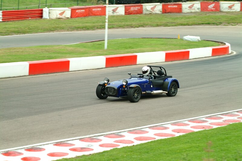 Blue Race Car on Track — Active, Afternoon