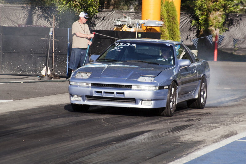 Blue Race Car on Track — Active
