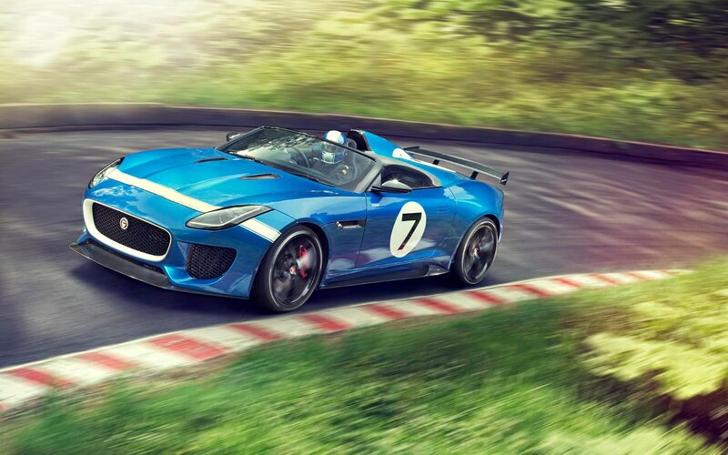 Blue Race Car on Track — Dynamic, Afternoon, Photograph, Driver, Race Track, Grass