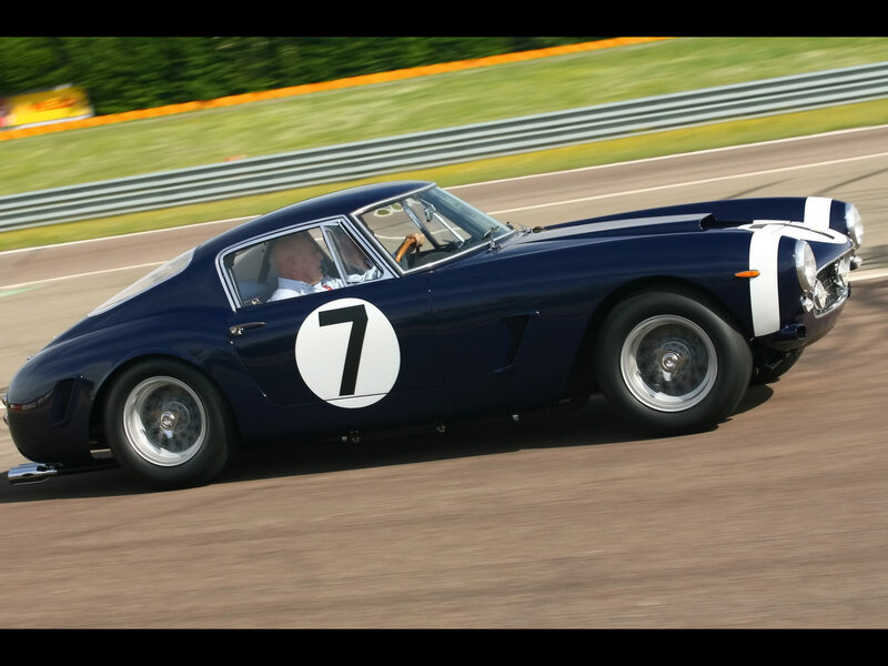 Blue Race Car on Track — Dynamic, Afternoon, Photograph, Driver, Race Track, Guardrail