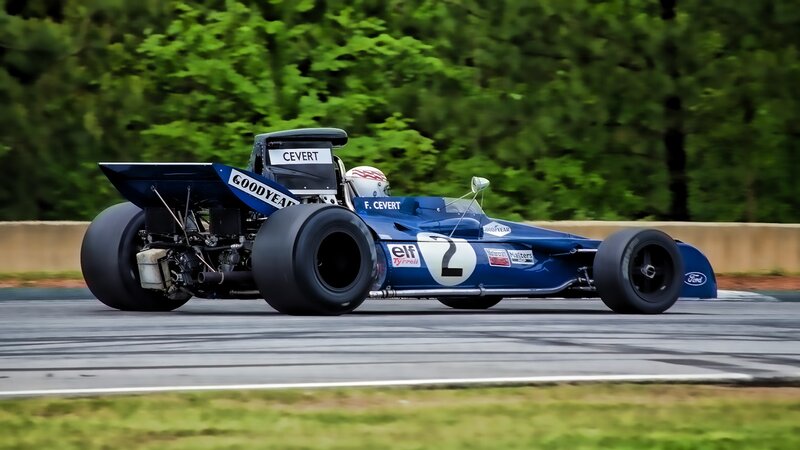 Blue Race Car on Track — Dynamic, Afternoon, Photograph, Driver, Trees