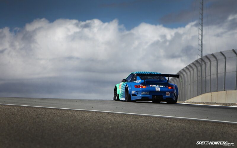 Blue Race Car on Track — Dynamic, Afternoon, Photograph, Race Car, Clouds