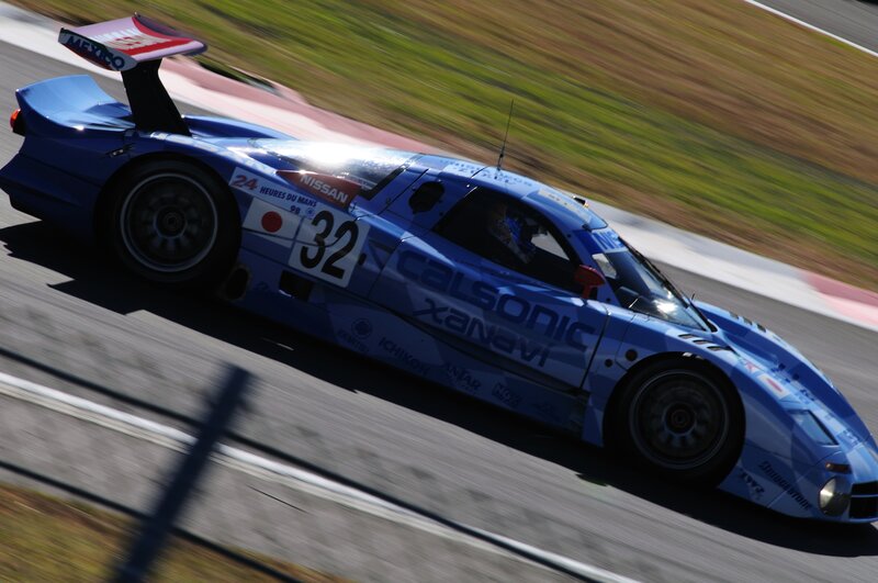 Blue Race Car on Track — Dynamic, Afternoon, Photograph, Race Car, Driver, White