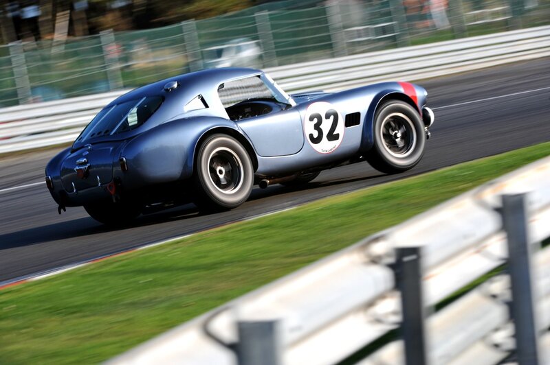 Blue Race Car on Track — Dynamic, Afternoon, Photograph, Race Track, Grass, Guardrail