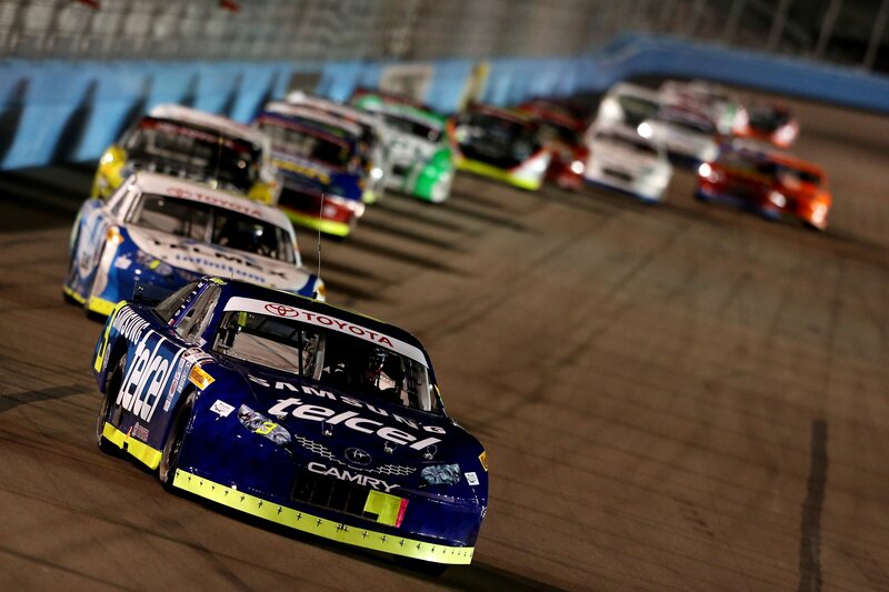 Blue Race Car on Track — Dynamic, Night
