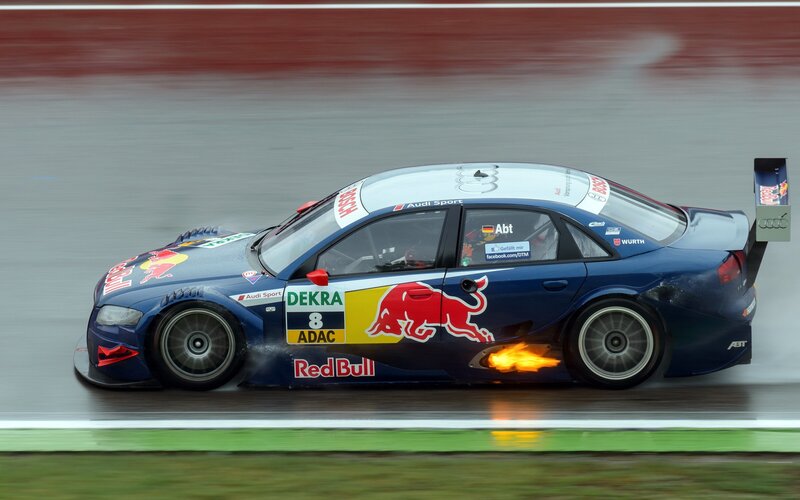 Blue Race Car on Track — Dynamic, Photograph, Flames