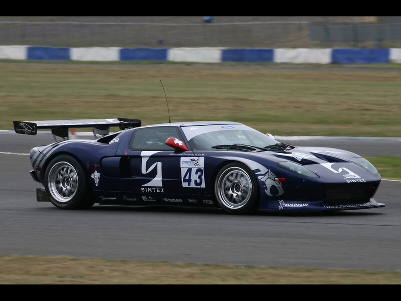 Blue Race Car on Track — Dynamic, Photograph, Race Car, Wings