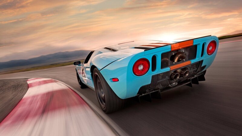 Blue Race Car on Track — Dynamic, Sunset, Photograph
