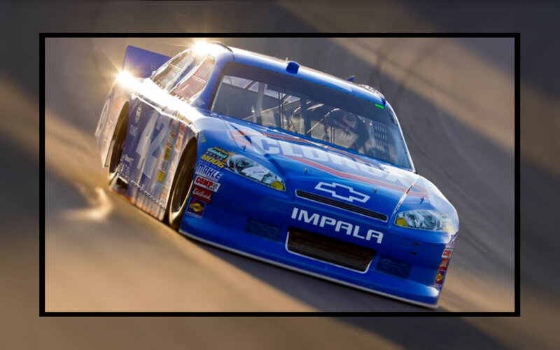 Blue Race Car on Track — Dynamic, Sunset