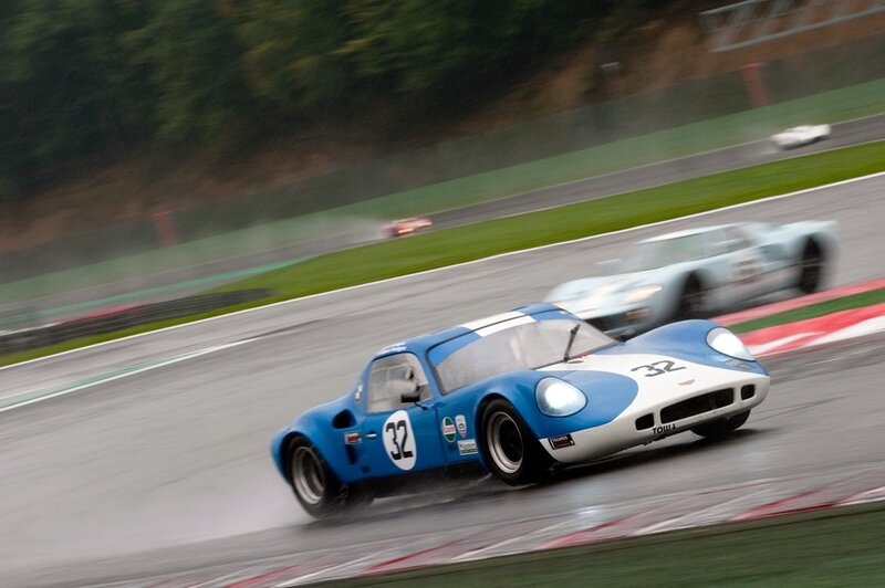 Blue race car on wet track