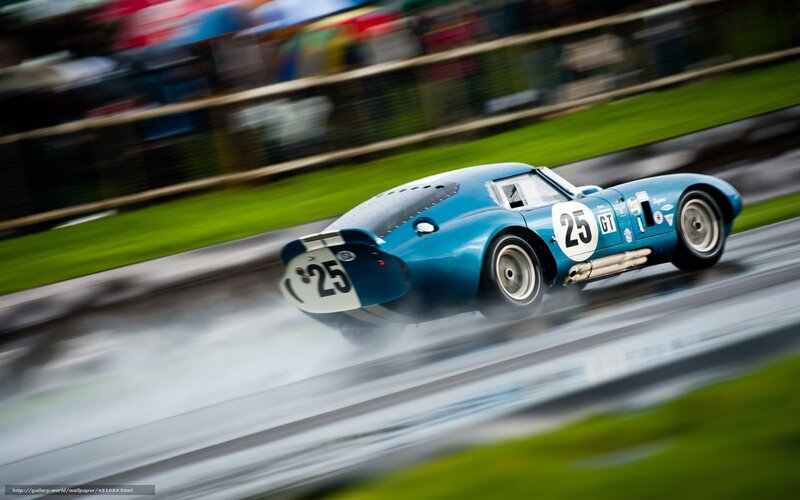 Blue race car on wet track