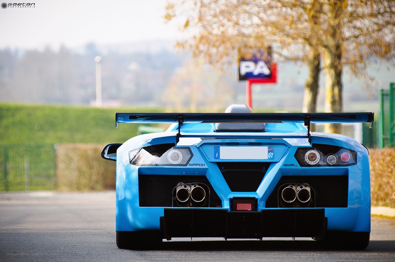 blue race car rear view