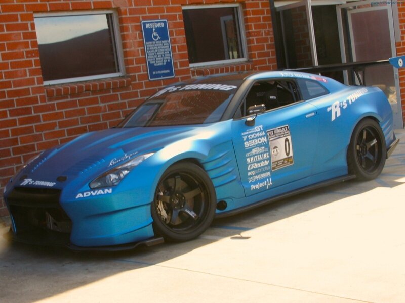 Blue Race Car — Static, Afternoon, Photograph, Brick Building