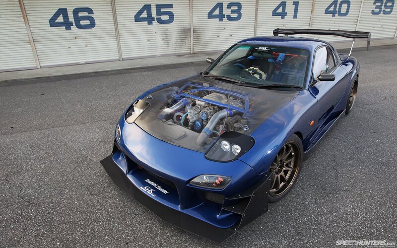 blue race car with exposed engine