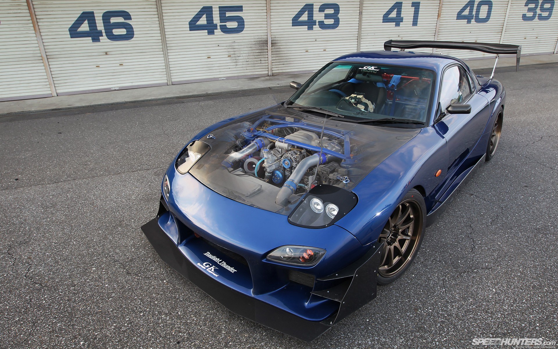 blue race car with exposed engine