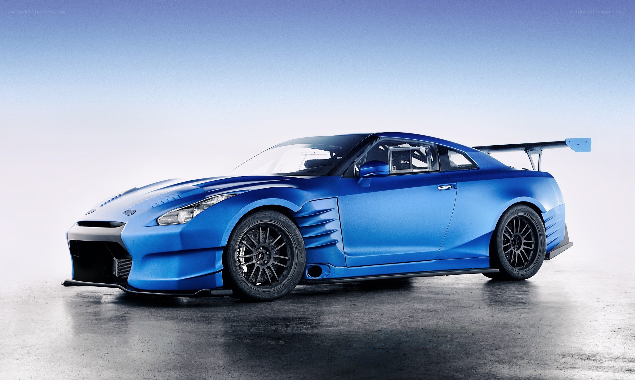 blue race car with large wing