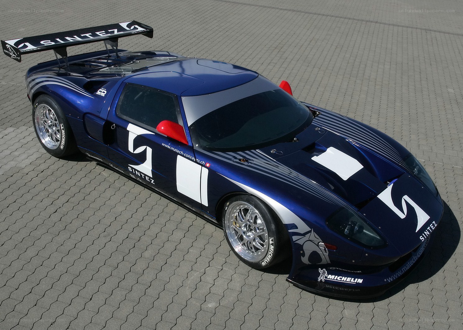 blue race car with large wing