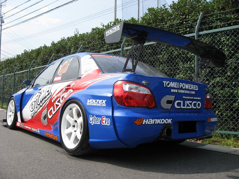 blue race car with large wing