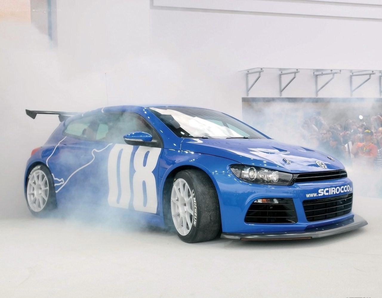 Blue race car with smoke