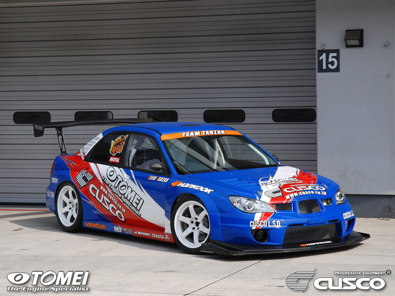 blue race car with sponsor decals