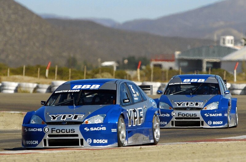 Blue race cars on a track