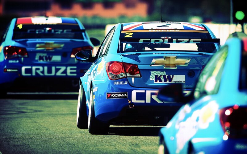 Blue race cars on track