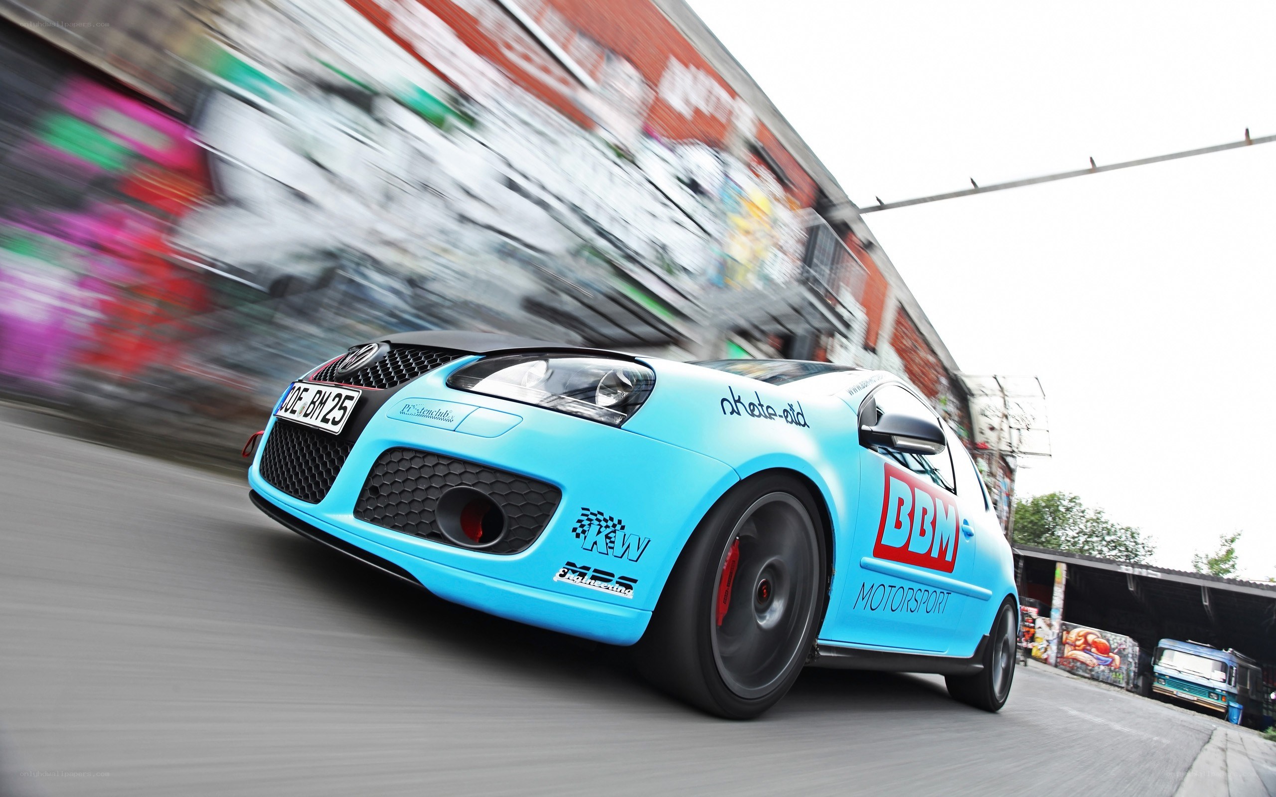 blue racing car in motion