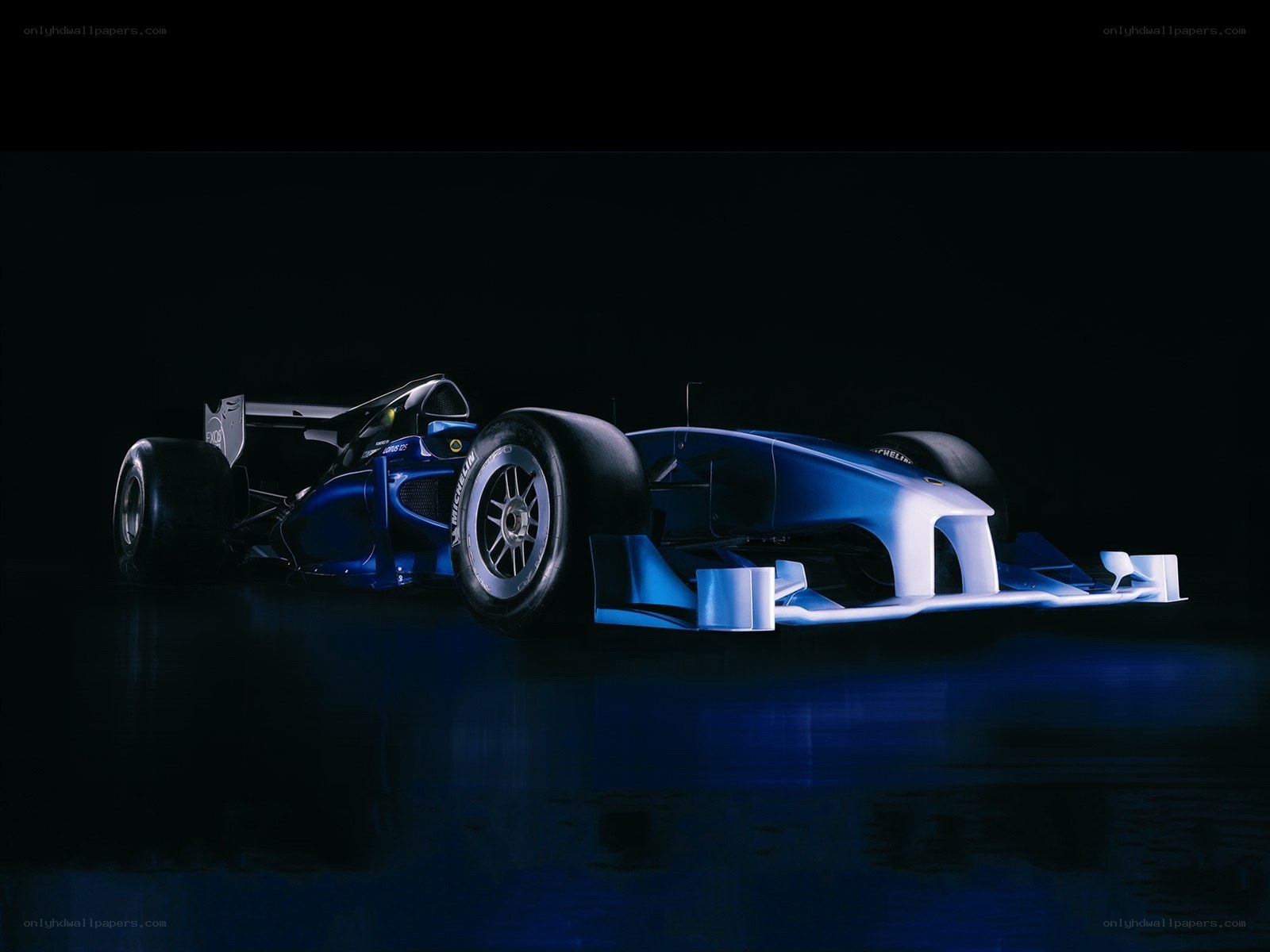Blue racing car on dark background